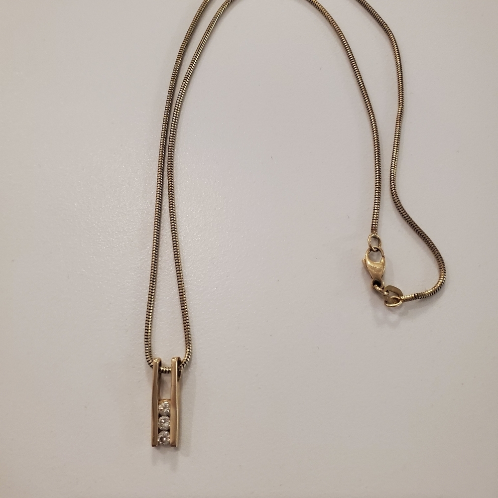 14 karat gold ladder with 3 Diamonds